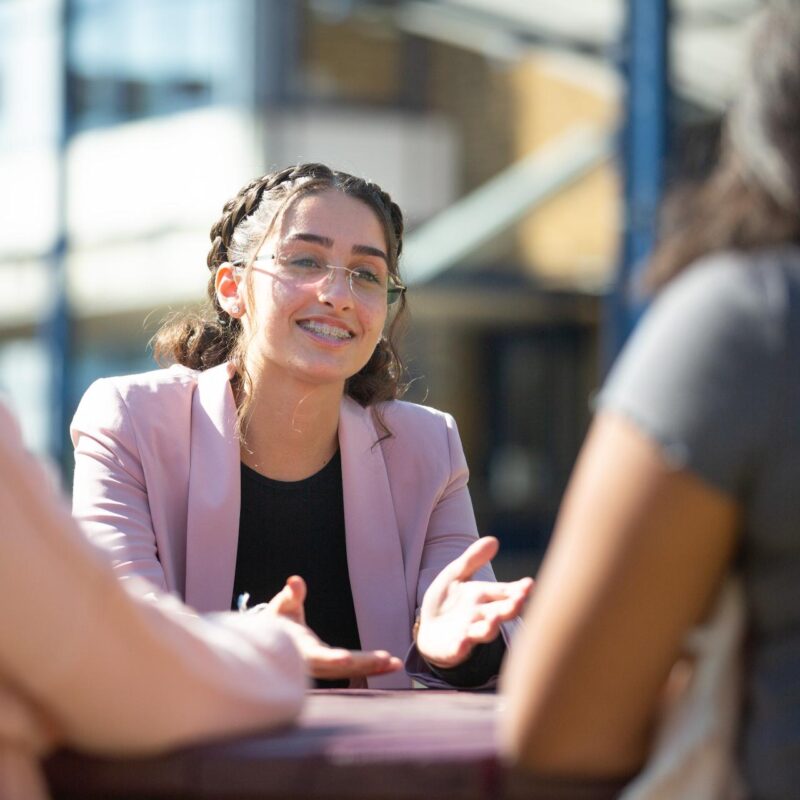 Post 16 students at a table outside