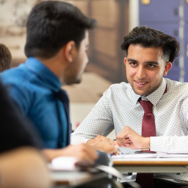 Students discussing something in class