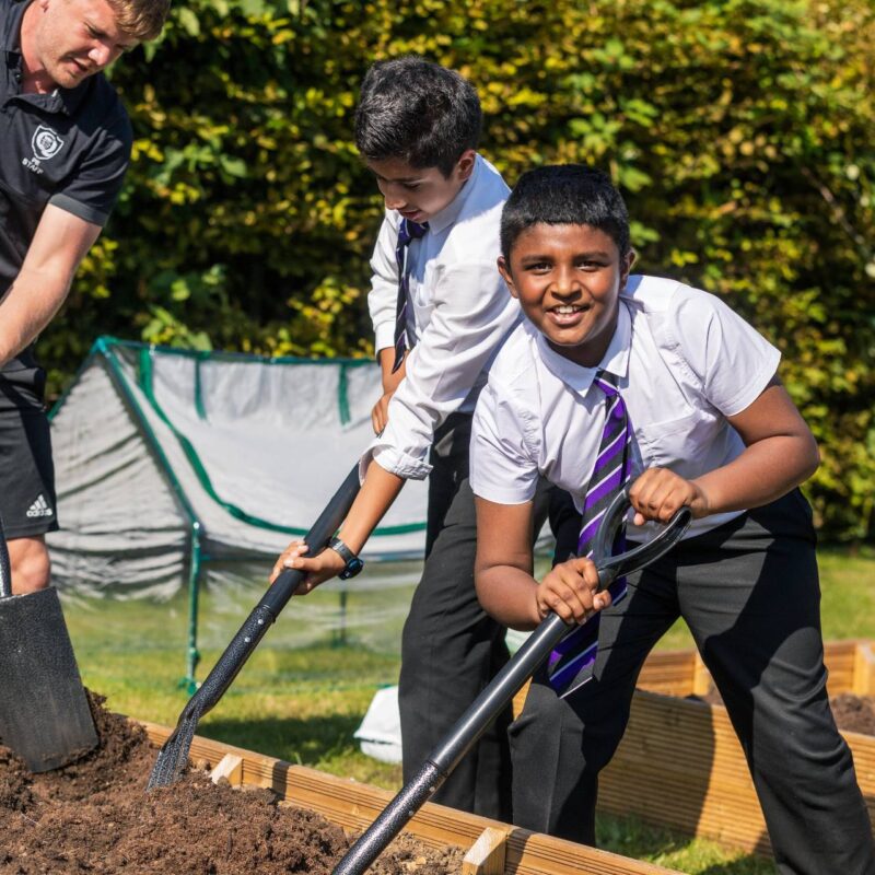 student gardening