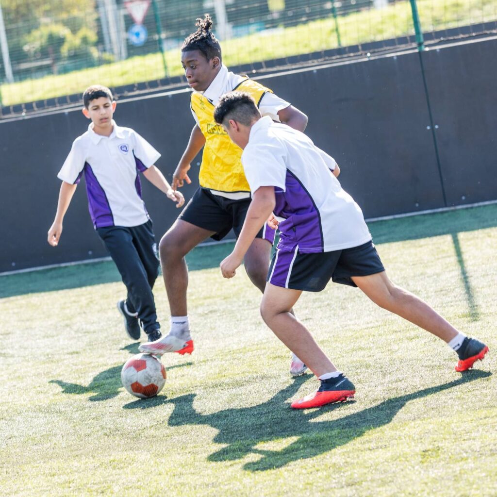 students playing football