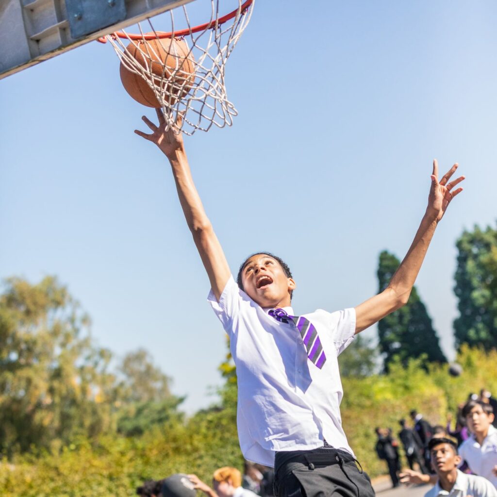 student playing basketball