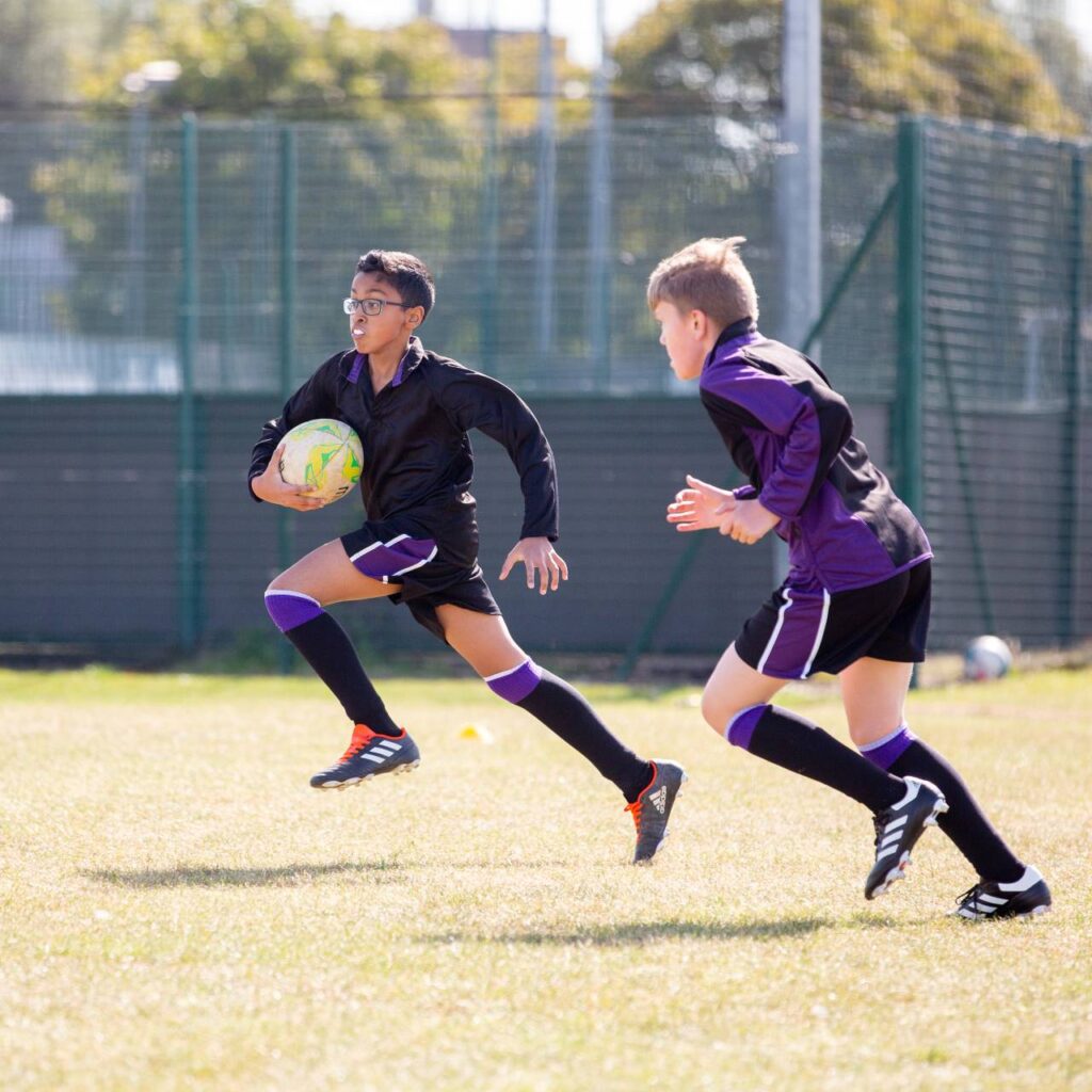 students playing rugby