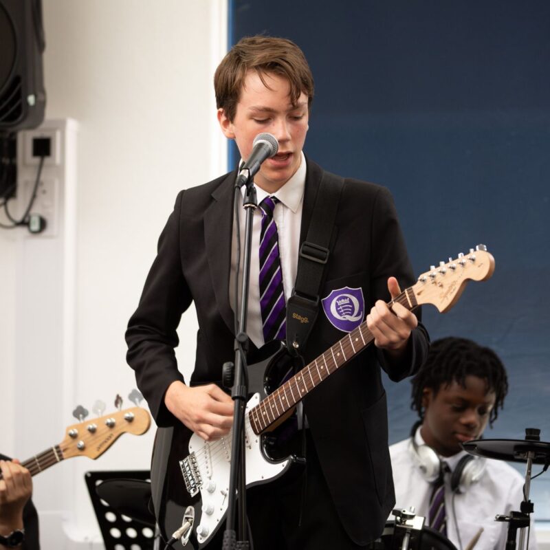 student playing guitar